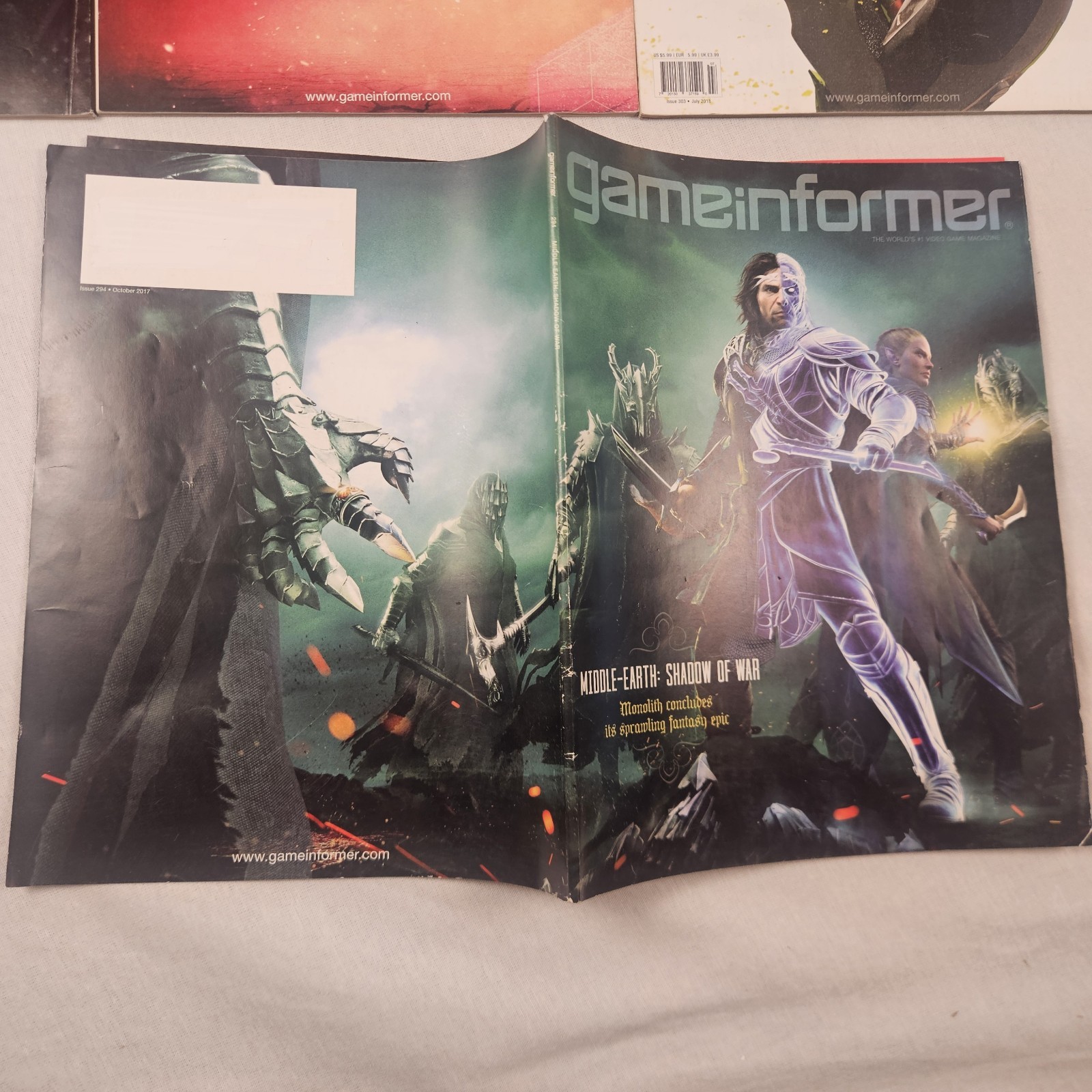 Lot of 7 Game Informer Magazines #s 294 303 (2 Variant Covers) 307 312 316 323