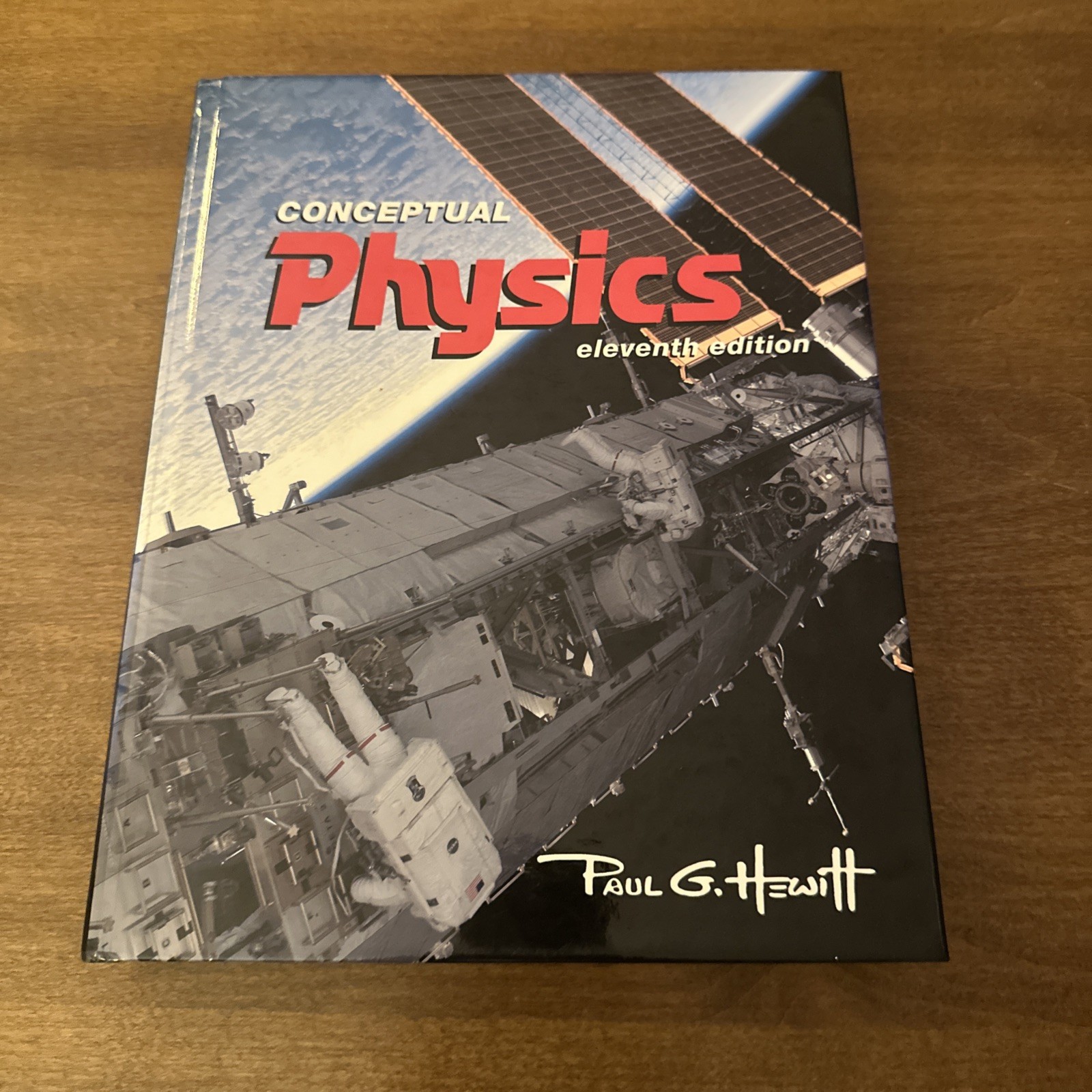 Conceptual Physics 11th Ed Book Paul G. Hewitt Hardcover – VERY GOOD